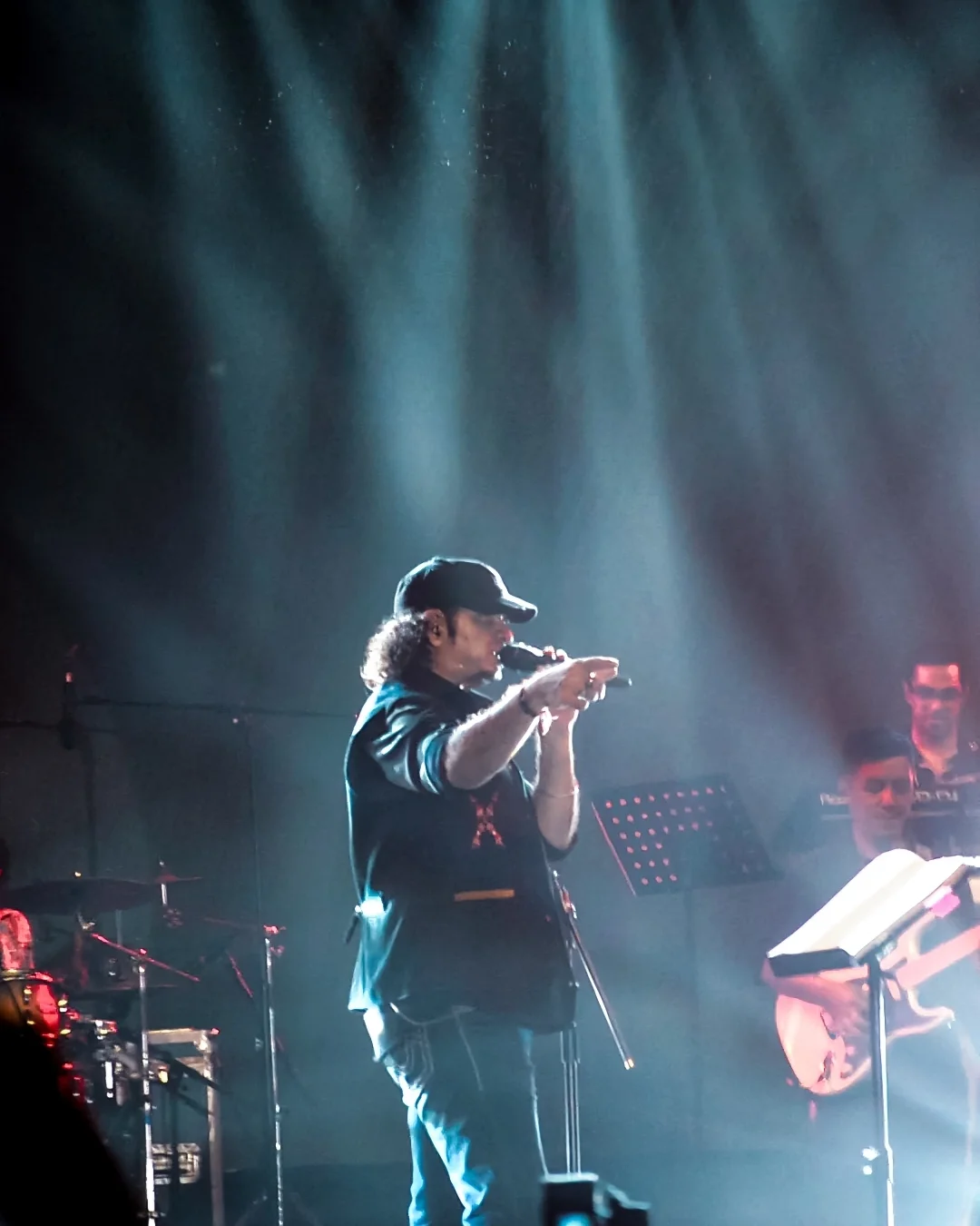 Sonu Nigam performing under stage lights at CEREBREXIA 2025
